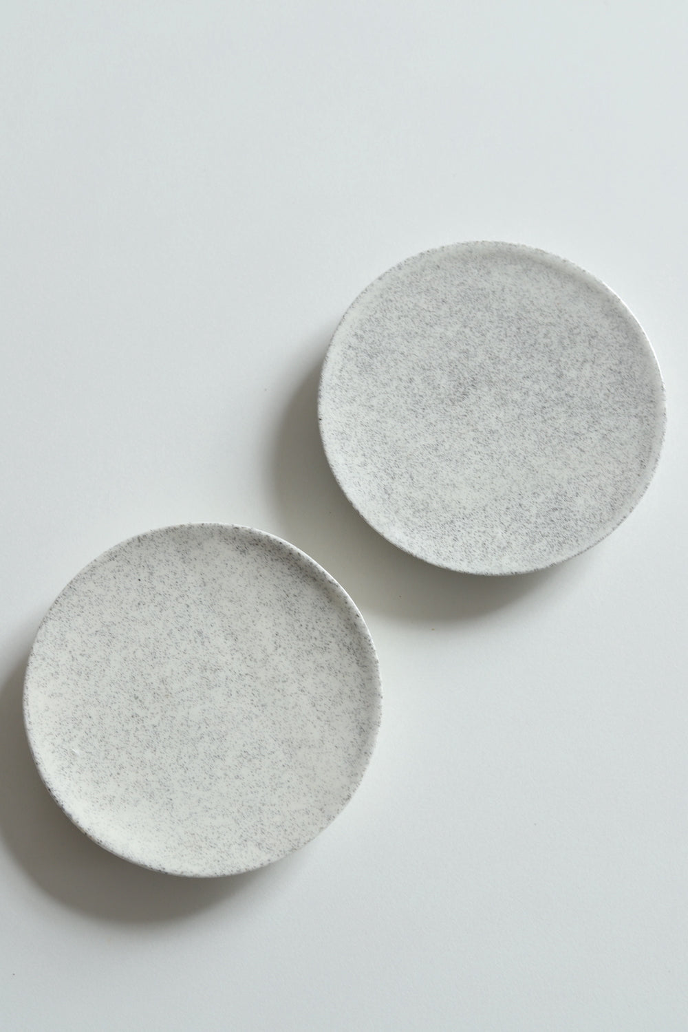 Two artisan ceramic small plates, app 8cm
